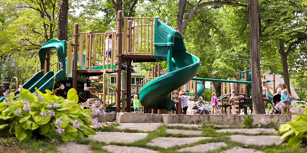 Children playing on playground equipment at Lake Ellyn Park